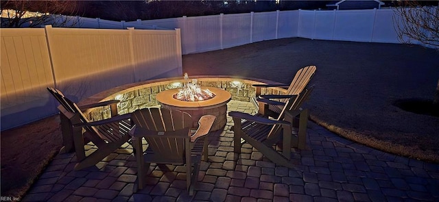 view of patio / terrace with a fenced backyard and an outdoor fire pit