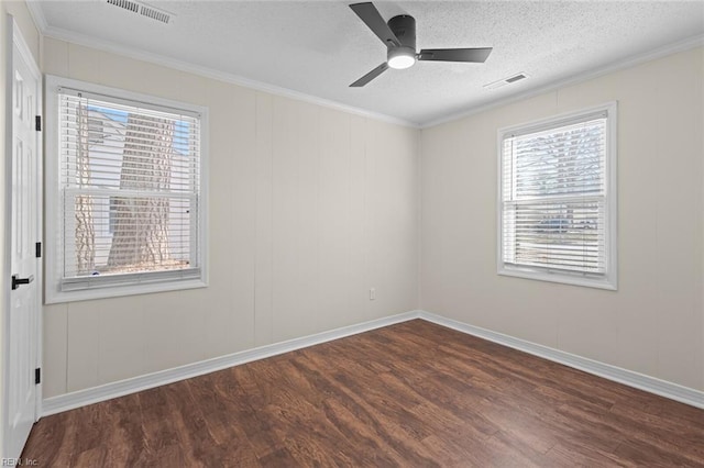 unfurnished room with visible vents, a textured ceiling, wood finished floors, and crown molding