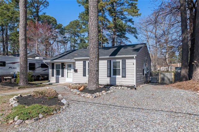 view of front facade featuring cooling unit and driveway