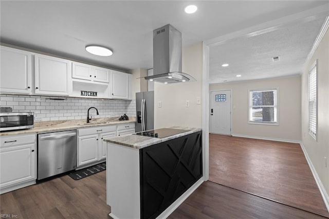 kitchen with dark wood finished floors, a sink, stainless steel appliances, white cabinetry, and exhaust hood