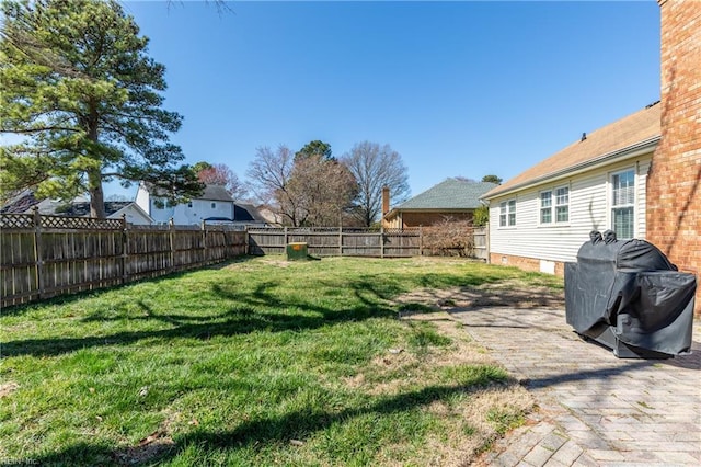 view of yard with a fenced backyard