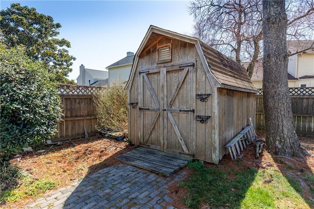 view of shed featuring a fenced backyard