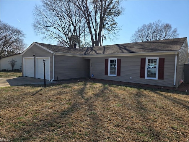 single story home featuring an attached garage and a front yard