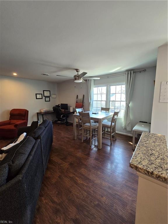 dining room featuring dark wood-style floors and ceiling fan