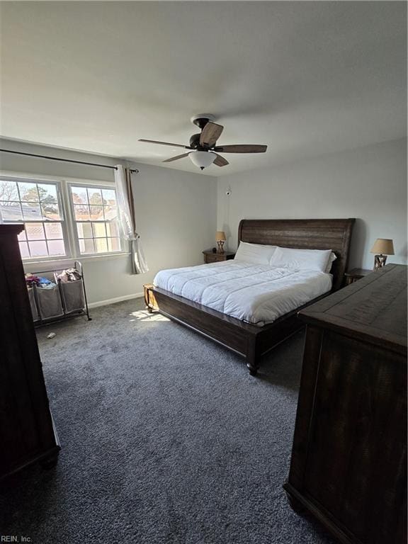 carpeted bedroom with baseboards and ceiling fan