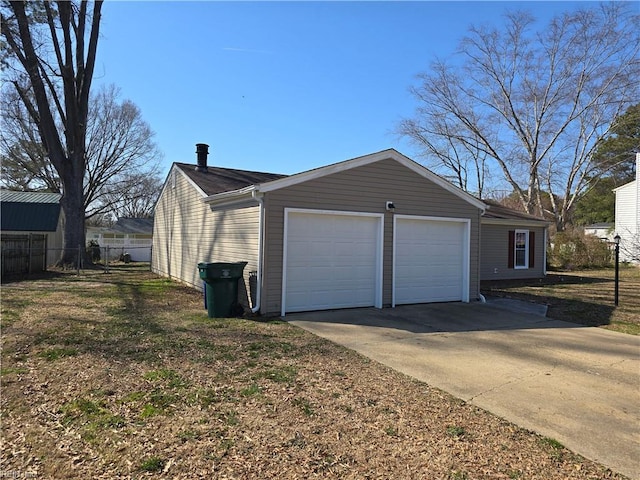 detached garage with fence