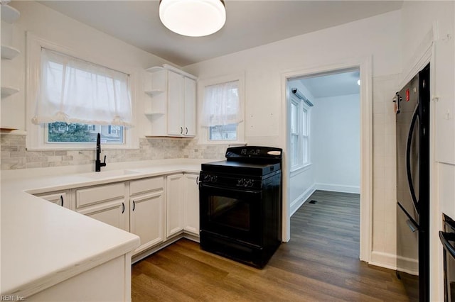 kitchen with black appliances, open shelves, a sink, white cabinetry, and dark wood-style flooring