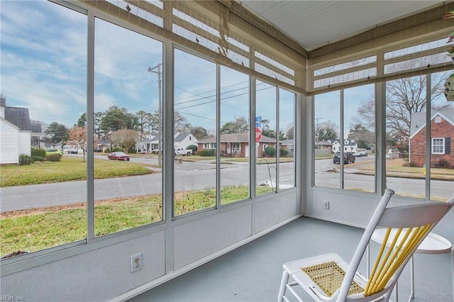 unfurnished sunroom with a residential view