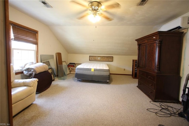 bedroom featuring visible vents, light carpet, lofted ceiling, and a wall mounted AC