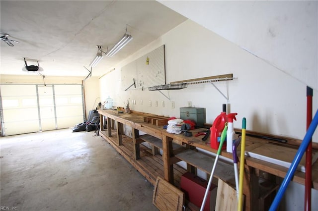 garage featuring a workshop area and a garage door opener