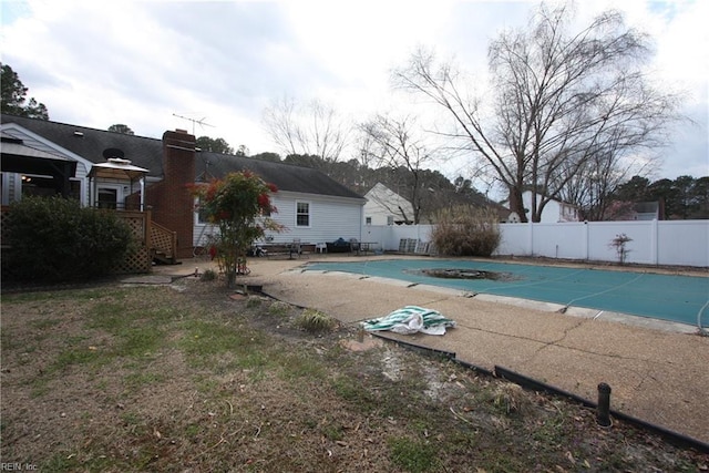 view of swimming pool featuring a fenced in pool, a patio, and a fenced backyard