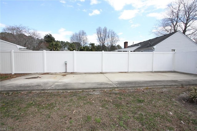 view of yard featuring a patio and fence