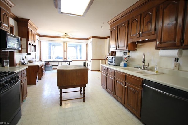 kitchen featuring dishwashing machine, gas stove, light floors, a sink, and black microwave