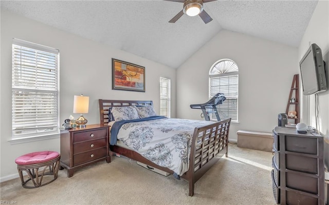 carpeted bedroom with baseboards, lofted ceiling, a textured ceiling, and a ceiling fan