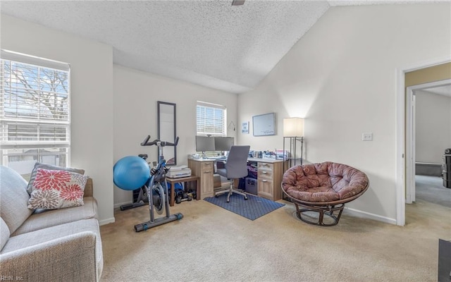 carpeted home office featuring lofted ceiling, baseboards, and a textured ceiling