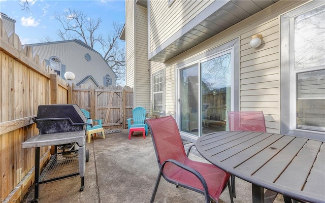 view of patio / terrace featuring outdoor dining area and fence