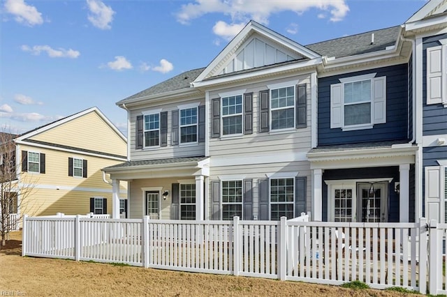 view of front of property with fence and board and batten siding