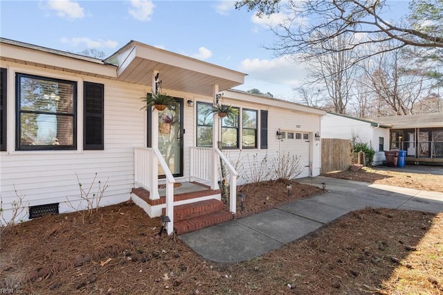 view of front facade with an attached garage and crawl space