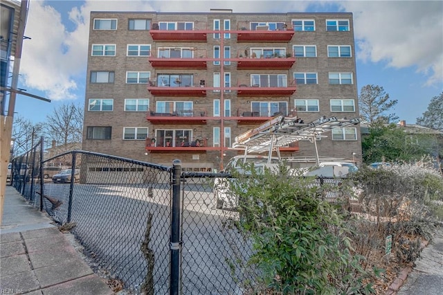 view of property with fence