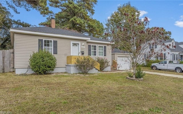 view of front of home featuring driveway, a chimney, a front lawn, and fence