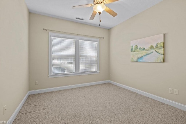 empty room featuring visible vents, baseboards, ceiling fan, and carpet flooring