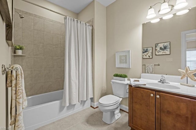 bathroom with vanity, tile patterned floors, toilet, shower / tub combo with curtain, and a chandelier