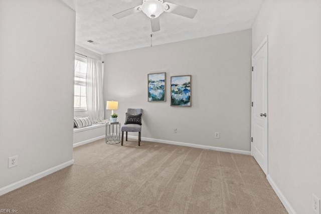 unfurnished room featuring visible vents, baseboards, carpet, and a ceiling fan