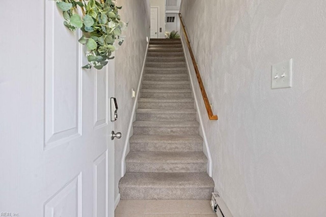 stairway with baseboard heating