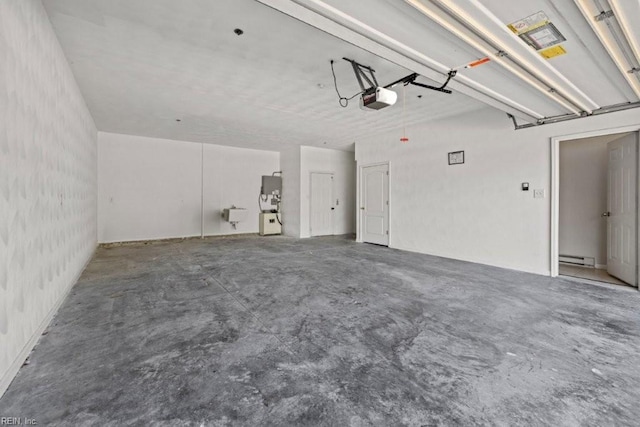 garage with a baseboard heating unit and a garage door opener