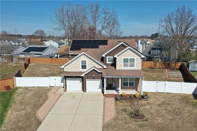 traditional home featuring solar panels, a porch, a gate, and a fenced backyard