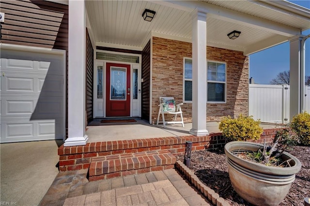 property entrance with a porch and a garage