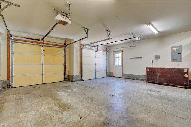 garage featuring electric panel and a garage door opener