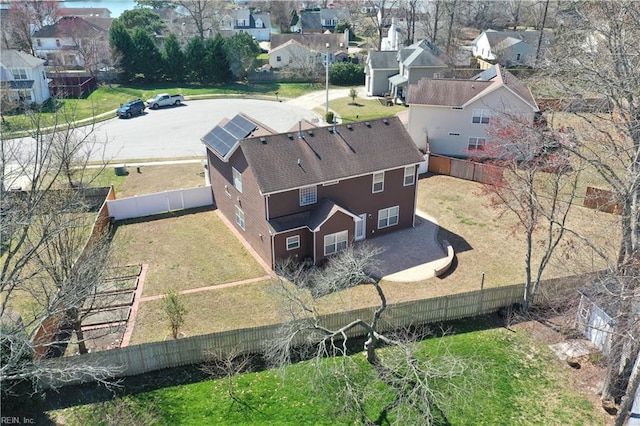 birds eye view of property with a residential view