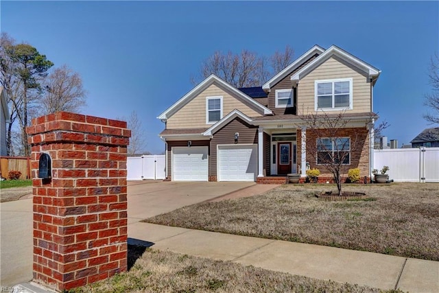 view of front of property with a gate, an attached garage, concrete driveway, and fence