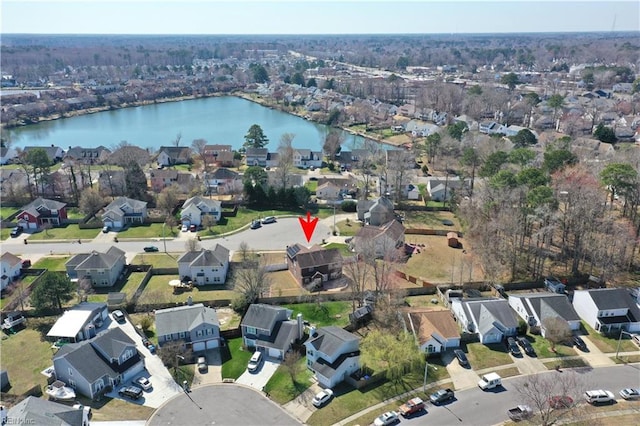 birds eye view of property with a water view and a residential view