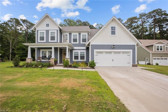 craftsman inspired home with board and batten siding, a porch, concrete driveway, a front yard, and a garage