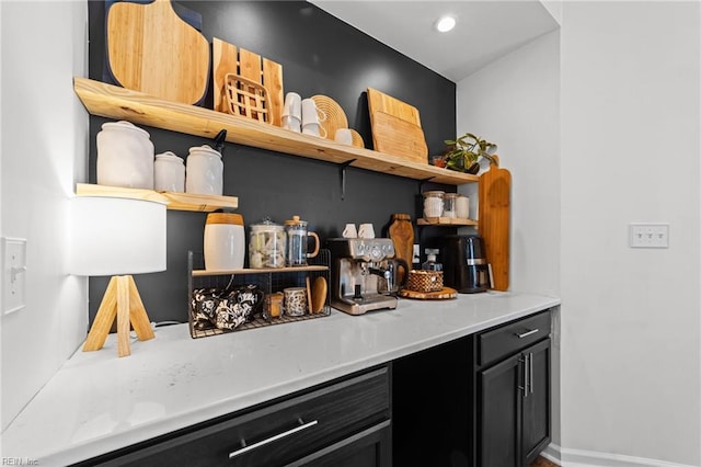 bar with recessed lighting and baseboards