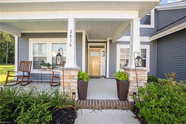 property entrance featuring a porch