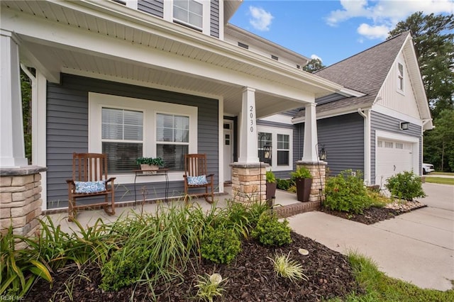 exterior space with a garage, stone siding, roof with shingles, and a porch