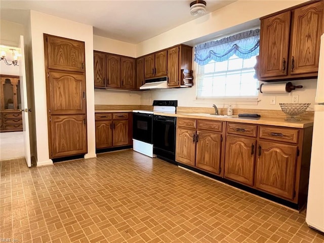 kitchen featuring brick patterned floor, under cabinet range hood, a sink, light countertops, and dishwasher