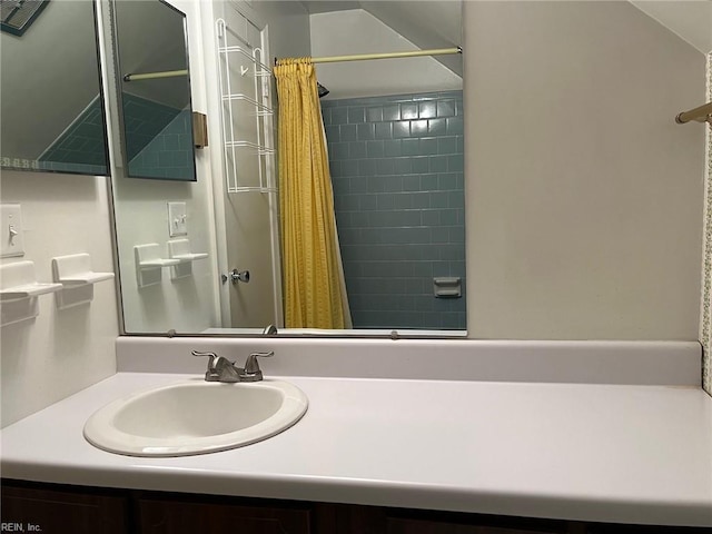 full bath with a shower with shower curtain and vanity