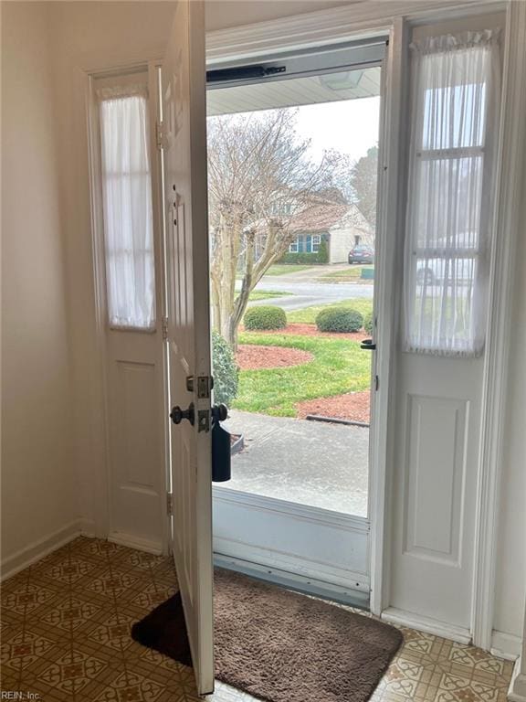 entryway featuring tile patterned floors and baseboards