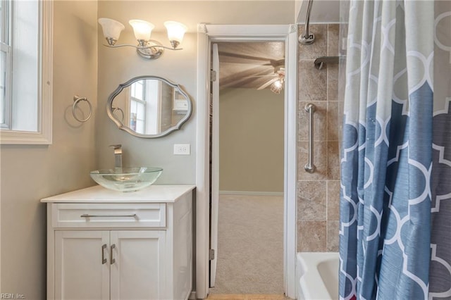 bathroom with vanity and shower / tub combo with curtain