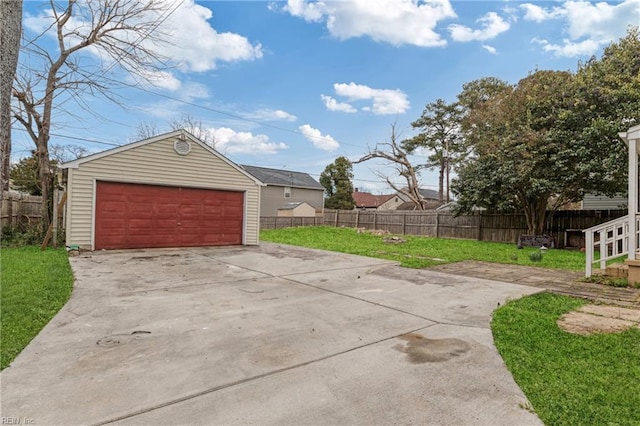 detached garage featuring fence