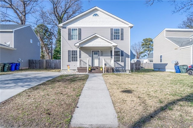 traditional home with a front lawn and fence