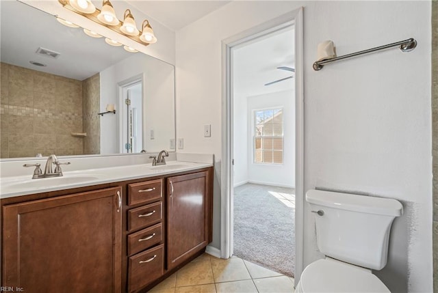 bathroom featuring tile patterned floors, visible vents, toilet, and a sink