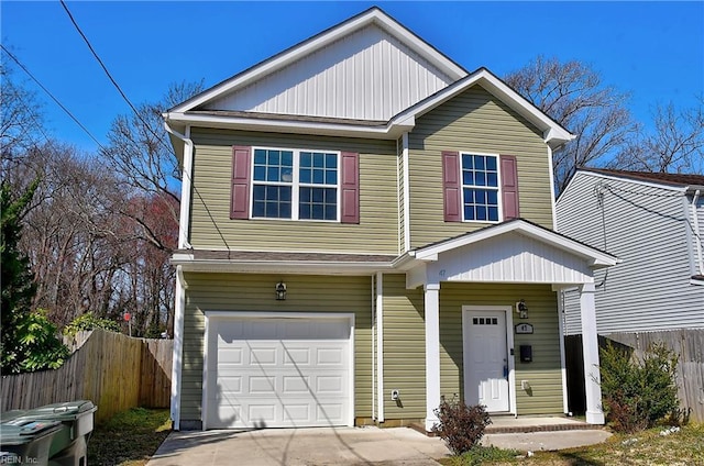 view of front of property featuring a garage, concrete driveway, and fence