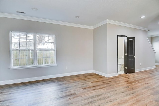 spare room with visible vents, baseboards, light wood finished floors, recessed lighting, and crown molding