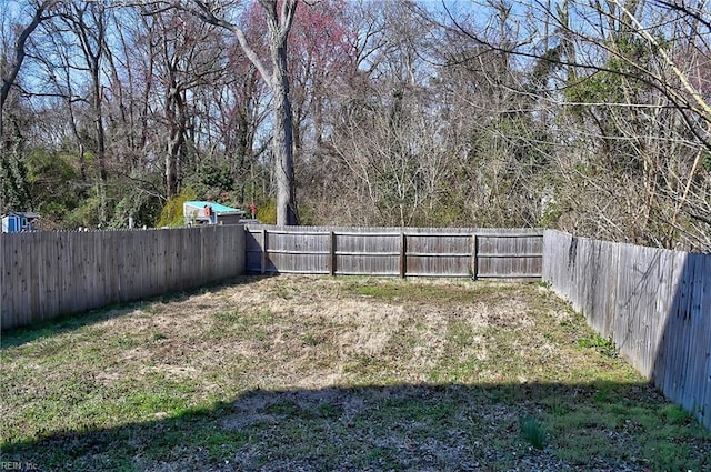 view of yard featuring a fenced backyard