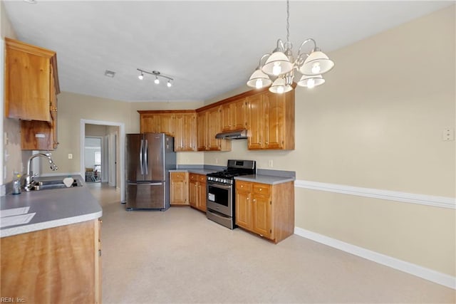 kitchen with baseboards, a sink, stainless steel appliances, under cabinet range hood, and a chandelier